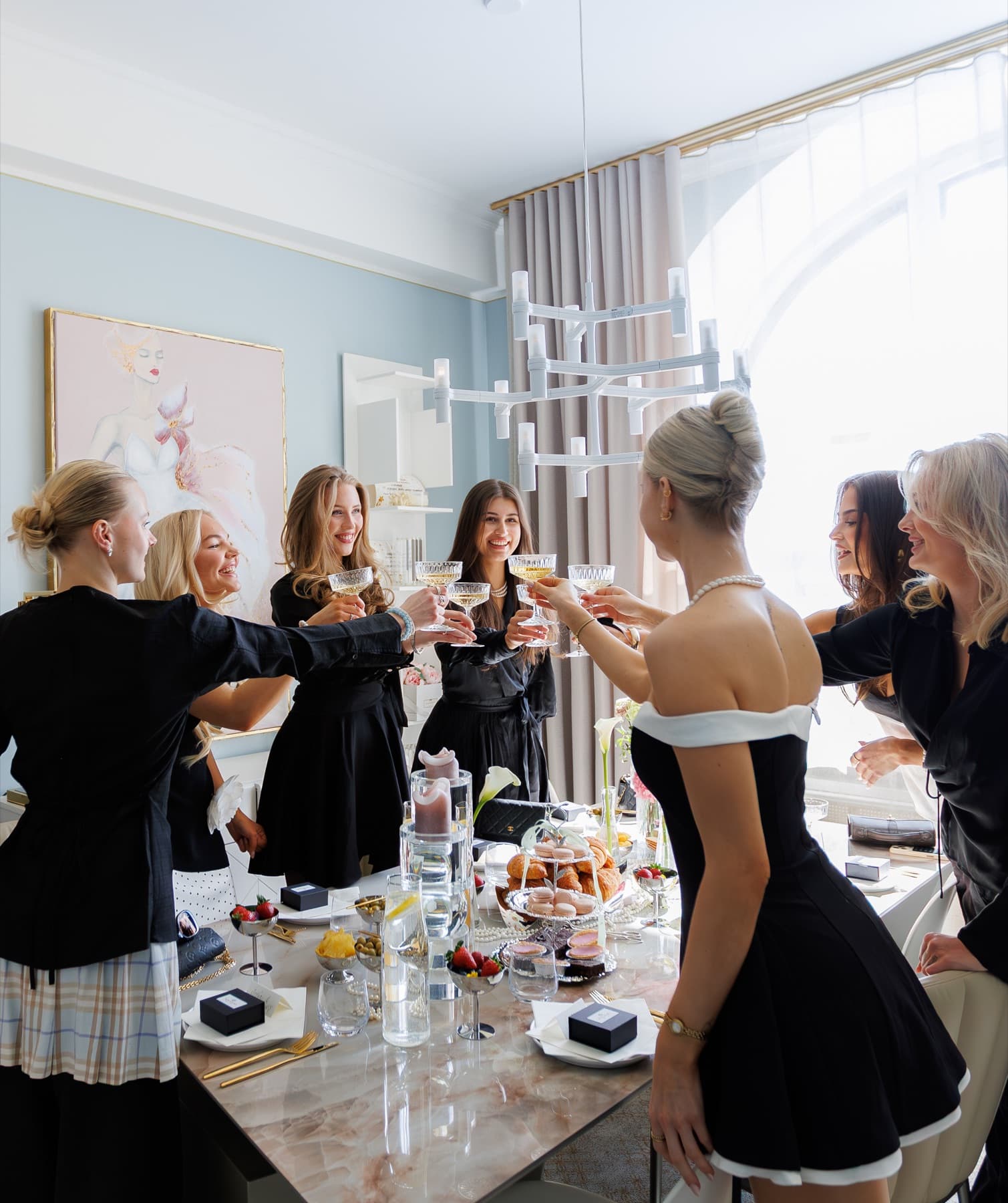 Guests raising glasses together at an Edna Social Club gathering in Helsinki