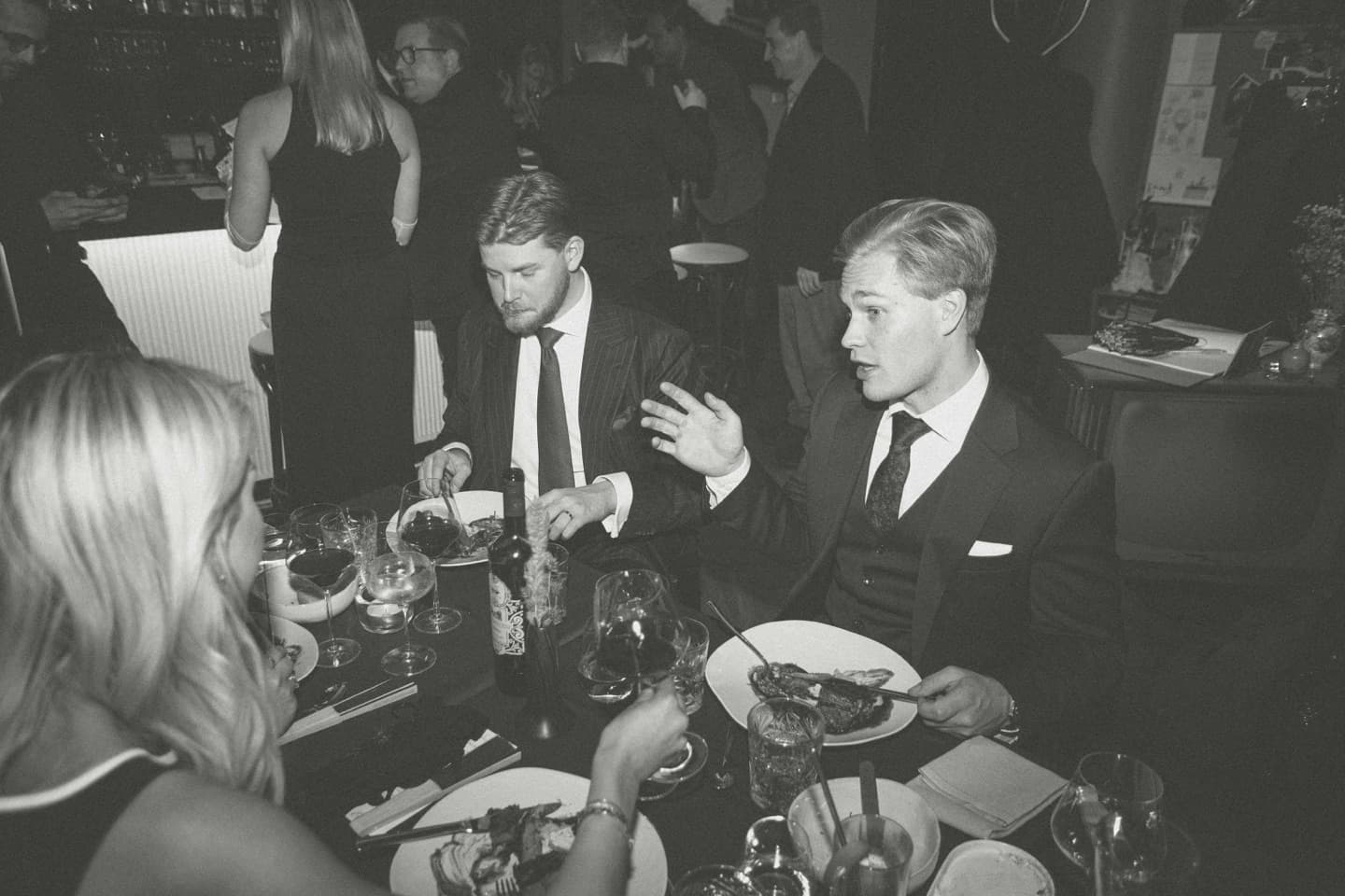 Guests sharing dinner and conversation at an Edna Social Club event in Helsinki