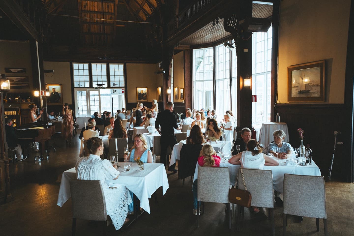 Guests seated in a warmly lit dining room during an Edna Social Club evening in Helsinki